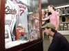 Published: No Published Caption Original: Published: Keith Barnes | Daily Times Luke Pecoraro, kneeling, his wife Casey, and her sister Brynn Horna, a Barton College student holding her son, Campbell, look over exhibits Sunday at the North Carolina Baseball Museum in Wilson.  Original: No Original Caption