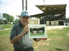 Published: No Published Caption Original: Published: Lee Gliarmis stands, holding a rendering of the museum, where the museum will be constructed next to Fleming Stadium.	            (Photo by Laura Keeter) Original: No Original Caption
